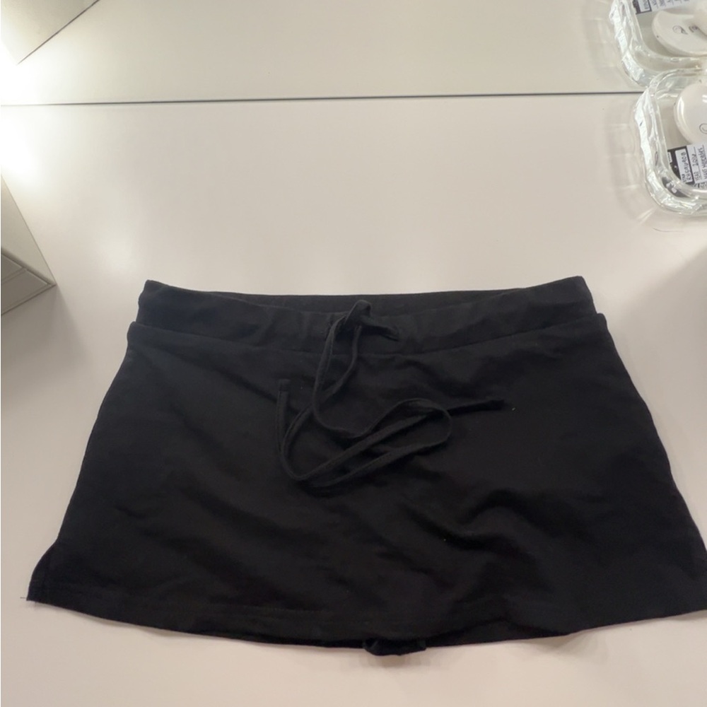 Edikted Black Mini Skirt. built in shorts. AS